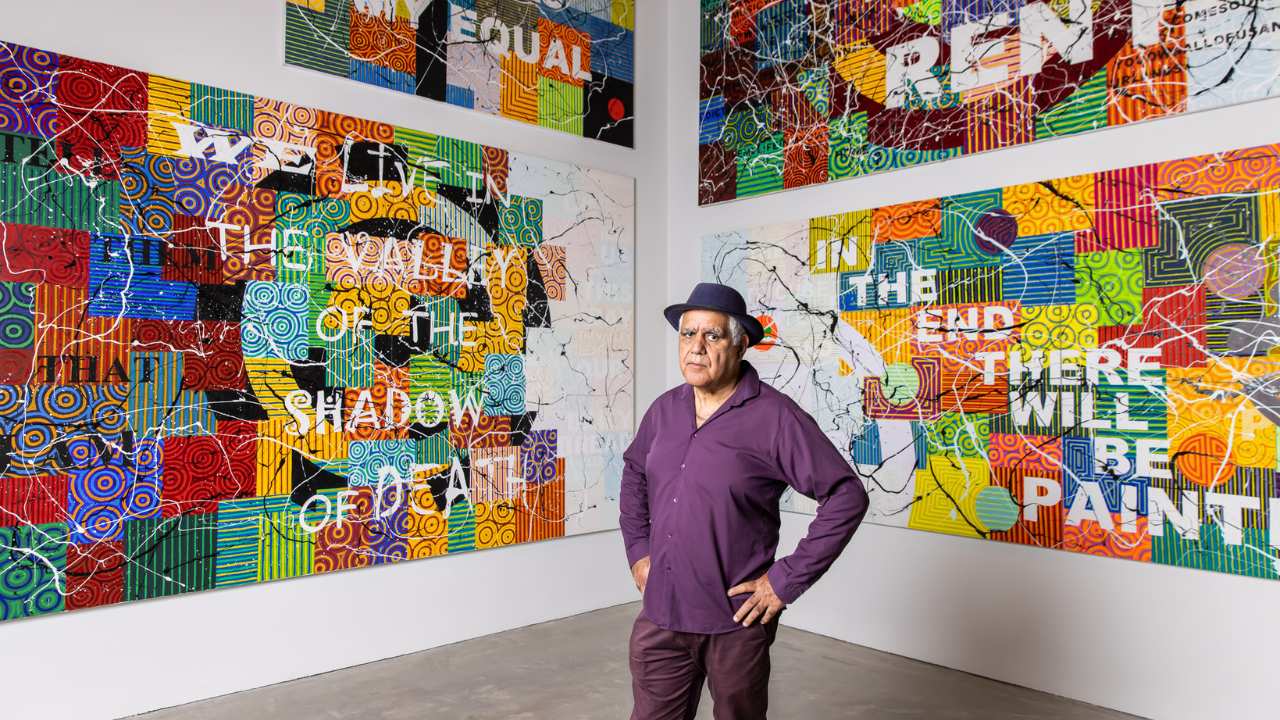 a man standing in an art gallery